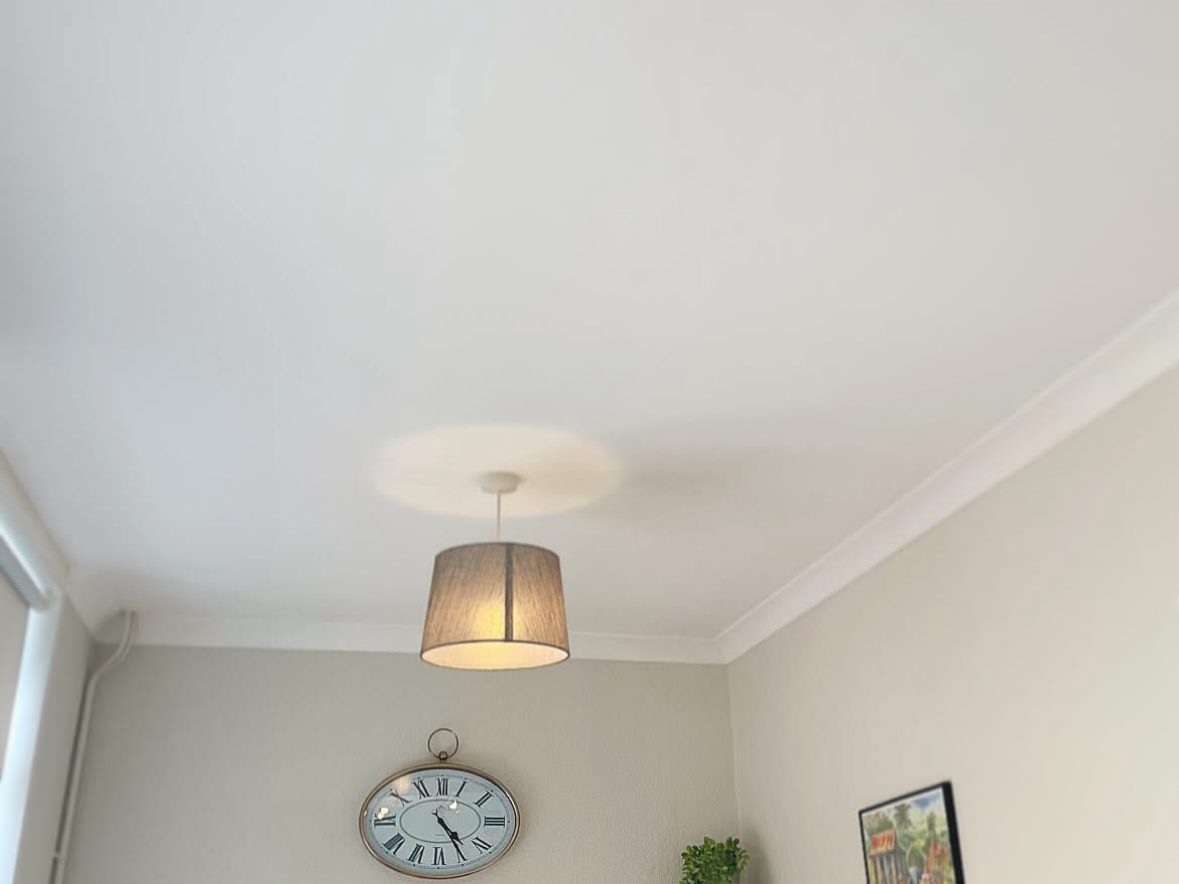 Ceiling after — smooth and repainted