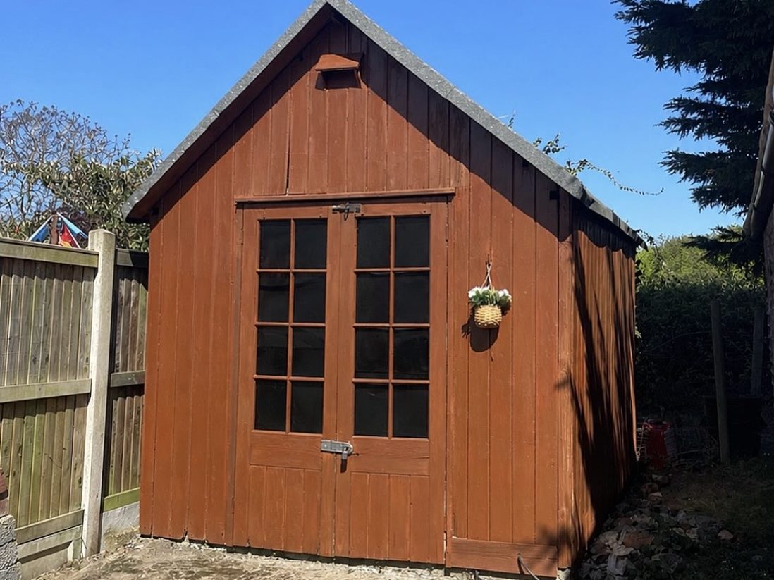 Garden shed after — re-stained