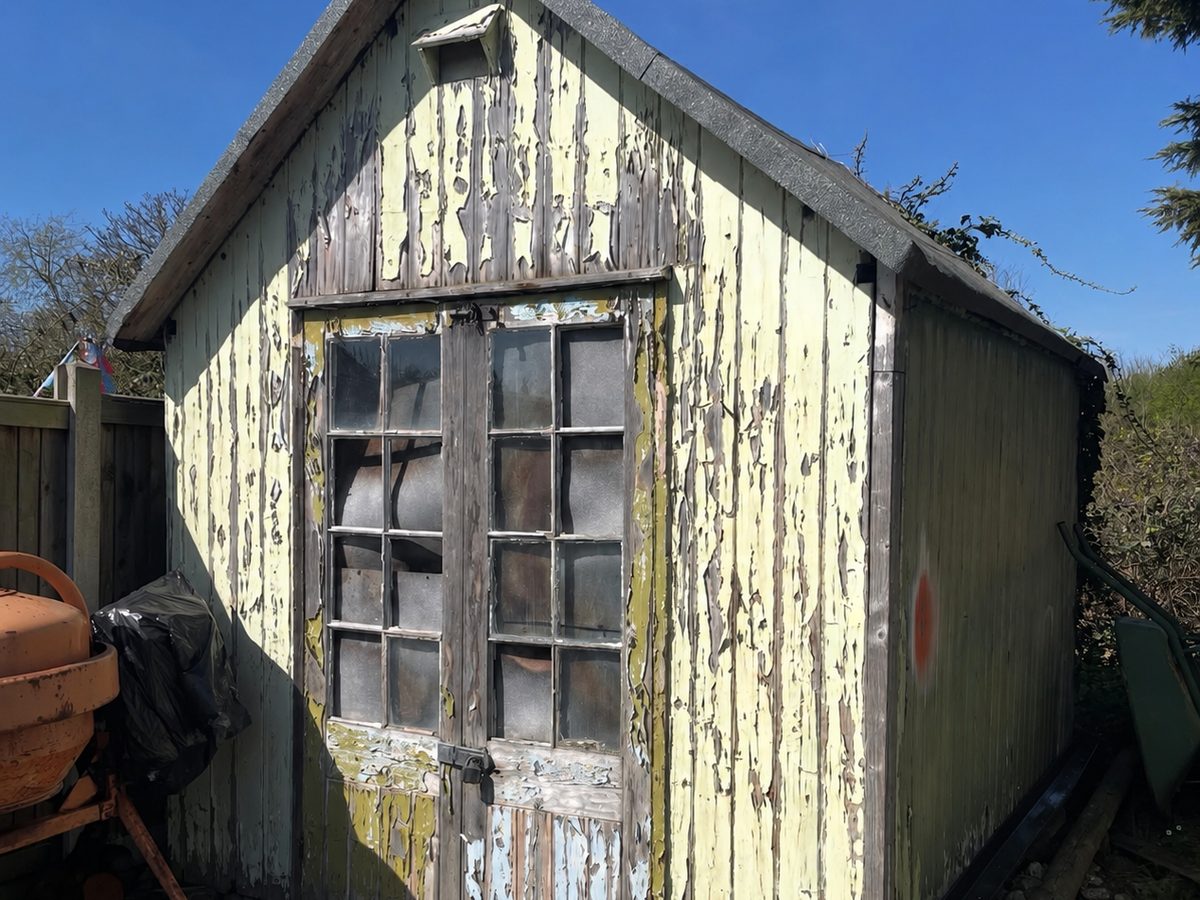 Garden shed before — peeling paint
